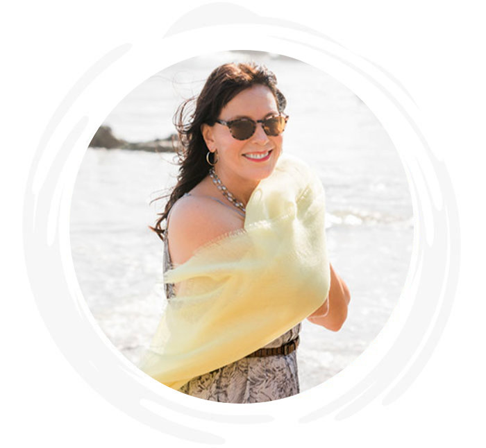 Julie Graham smiling near the ocean